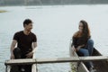 Couple with traditional canoe together on a lake Royalty Free Stock Photo