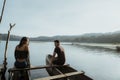 Couple with traditional canoe together on a lake Royalty Free Stock Photo