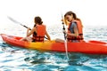 Couple kayaking together. Beautiful young couple kayaking on lake together and smiling at sunset Royalty Free Stock Photo