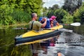Couple kayaking together in river. Tourists kayakers touring the river Royalty Free Stock Photo