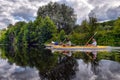 Couple kayaking together in river. Tourists kayakers touring the river Royalty Free Stock Photo