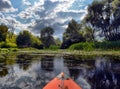 Couple kayaking together in river. Tourists kayakers touring the river