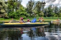 Couple kayaking together in river. Tourists kayakers touring the river Royalty Free Stock Photo