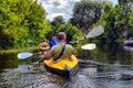 Couple kayaking together in river. Tourists kayakers touring the river Royalty Free Stock Photo