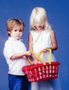 Couple kids hold plastic shopping basket toy. Mall shopping. Buy with discount. Buy products. Play shop game. Cute buyer Royalty Free Stock Photo