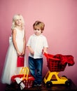 Couple kids hold plastic shopping basket toy. Kids store. Mall shopping. Buy products. Play shop game. Cute buyer Royalty Free Stock Photo