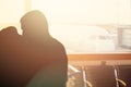 Couple kiss on the background of the aircraft. The concept of meeting or parting two people Royalty Free Stock Photo