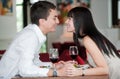 Couple Kiss Over Meal Royalty Free Stock Photo