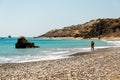 A couple kissing on a beach near Aphrodite Rock in Cyprus