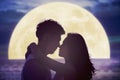 couple kissing on beach and watching the moon.Celebrate Mid autumn festival