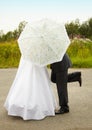 Couple kissing behind an umbrella Royalty Free Stock Photo