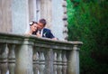 Couple kissing on building balcony