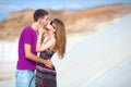 Couple kissing in the desert