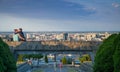 A couple kissing in front of Bratislava war memorial SlavÃÂ­n skyline, panorama