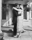 Couple kissing on front porch Royalty Free Stock Photo