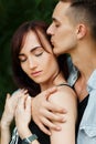 Couple kissing happiness fun. Interracial young couple Royalty Free Stock Photo