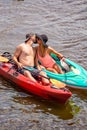 Couple kissing in kayaks at the 4th Annual Paddle Pub Crawl 7/28/18