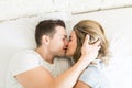 Couple Kissing While Lying In Bed Royalty Free Stock Photo