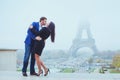 Couple kissing near Eiffel Tower in Paris, valentines day