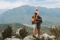Couple kissing outdoor family hiking with child travel in mountains Royalty Free Stock Photo