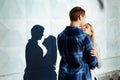 Couple Kissing Shadow.the shadow of a couple, between a man and a woman, kiss embracing. profile, silhouette