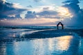 Couple kissing at sunrise on a beach