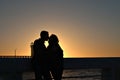 Couple kissing at sunset