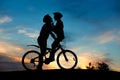 Couple kissing on the top of hill at sunset. Royalty Free Stock Photo