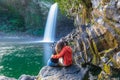 Couple kissing under the Bassin La Paix waterfall in Reunion Island