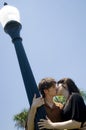 Couple kissing under street light Royalty Free Stock Photo