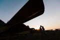 Couple is kissing under the vintage plane