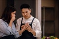 Couple in the Kitchen. Accident while Preparing Food