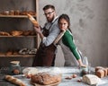 Couple in kitchen looking seriuosly at camera Royalty Free Stock Photo