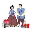 Couple in Korean traditional costume with holiday gifts