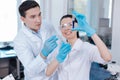 Couple of lab assistants looking at assay reagent Royalty Free Stock Photo