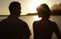 Couple By Lake Enjoying Sunset