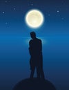 Couple by the lake with full moon in a starry night Royalty Free Stock Photo