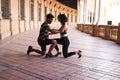 Couple of latin and bachata dancers dancing in a square. They are a young and handsome man and a beautiful woman. Dance concept Royalty Free Stock Photo