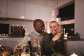 Couple laughing with friends during a candlelit dinner party Royalty Free Stock Photo