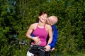 Couple Laughing Next to Bike - Horizontal Royalty Free Stock Photo