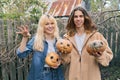 Couple of laughing teenagers with halloween pumpkins having fun Royalty Free Stock Photo