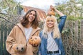 Couple of laughing teenagers with halloween pumpkins having fun Royalty Free Stock Photo