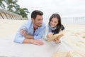 couple laying out on beach Royalty Free Stock Photo