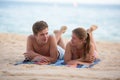 Couple laying together on beach Royalty Free Stock Photo