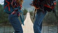 Couple legs dance together on nature river bridge. Tourists moving body outside. Royalty Free Stock Photo