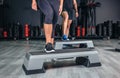 Couple legs over steppers training in aerobic Royalty Free Stock Photo