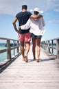 Couple legs, walking and beach deck on a tropical island on vacation with freedom by sea. Ocean, relax and walk of a man Royalty Free Stock Photo