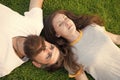 Couple lie on green grass. man and woman relax outdoor. dreaming concept. Dating concept. bearded hipster and girl