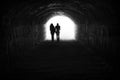 Couple and light in the end of the tunnel Royalty Free Stock Photo