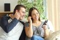 Couple listening music and sharing earphones Royalty Free Stock Photo